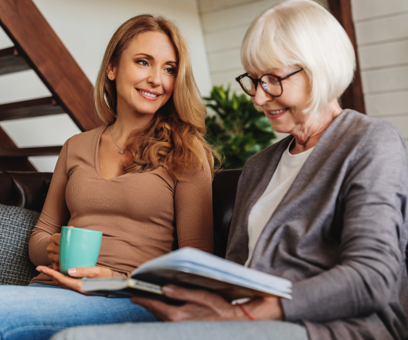 Woman sitting with her adult daughter